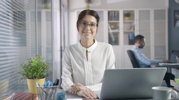 Beautiful Attractive Creative Young Businesswoman in Glasses Working on PC in Sitting Office