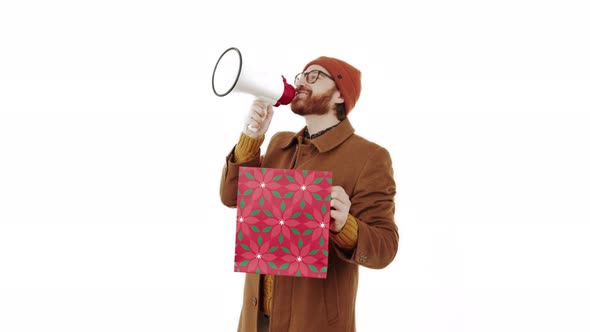 European Guy with Loudspeaker Screams and Announces Huge Sales While Holding His Own Purchase Copy