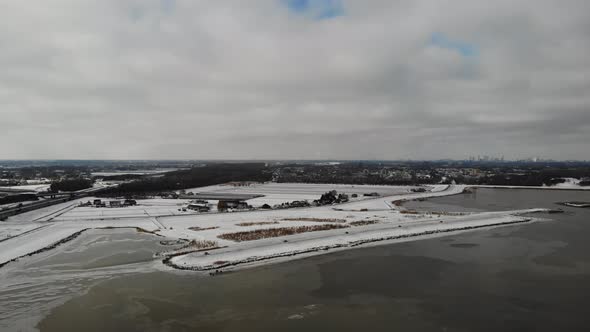 Crezeepolder Nature Reserve With Noord River At Winter In Hendrik-Ido-Ambacht, Netherlands. - aerial