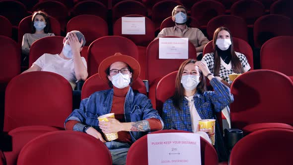 Viewers Wearing Face Masks Laugh at the Movies