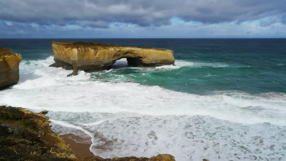 wide shot of the limestone formation known as london bridge on the great ocean road