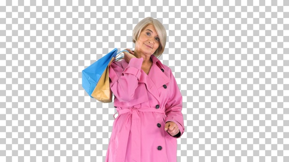 Beautiful senior woman in trench coat, Alpha Channel