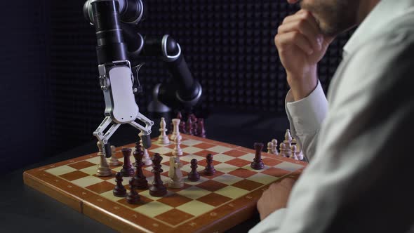 Robot Playing Chess with a Man, the Confrontation Between Man and Artificial Intelligence, Checkmate