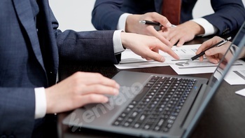 A business person making a comment at a meeting