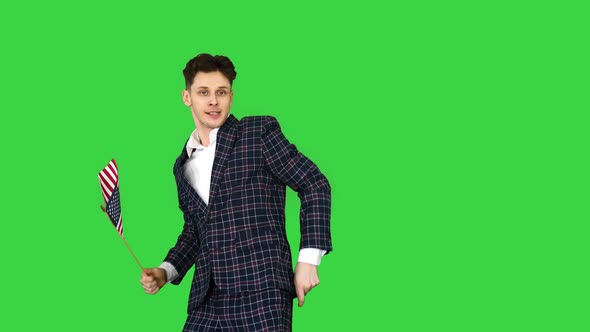 Cool Man in Suit Does Crazy Dancing with American Flag on a Green Screen, Chroma Key.