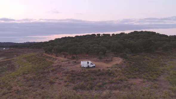 Drone panoramic aerial view of a camper van living vanlife at Minutos Dam in Arraiolos Alentejo