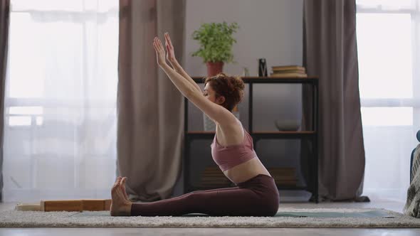 Stretch Workout at Home Adult Woman is Sitting on Floor in Room and Stretching Her Body Interior of