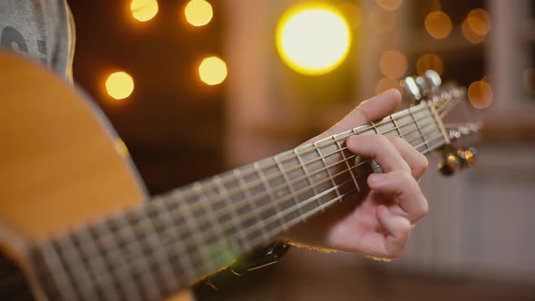 Man Plays Guitar Close-up