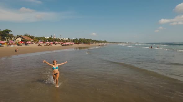Girl Running on the Beach