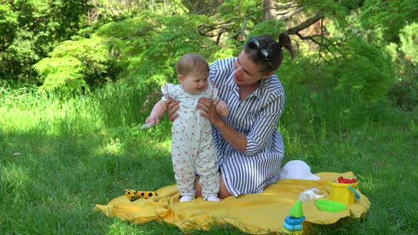 Mother with daughter in the park