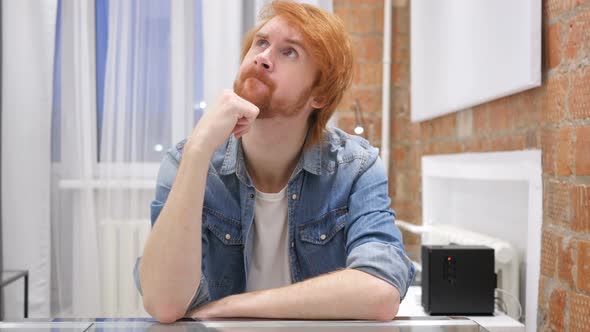 Portrait of Thinking Redhead Beard Man