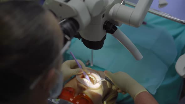 Woman Dentist Treats a Woman