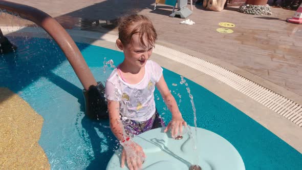 Girl Playing In Fountain