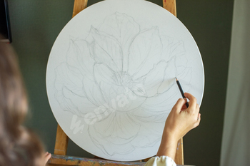 Artist Sketching a Flower on Canvas