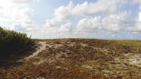 Flying Over Hill into the Baltic Sea beach