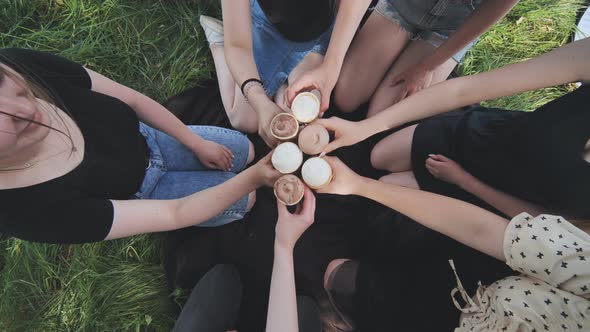 Girls Friends Join Hands with Ice Cream in Waffle Cups in a Circle