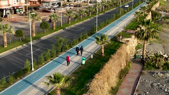 People walk around the embankment