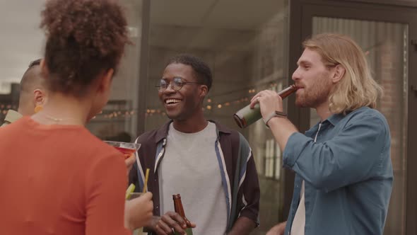 Cheerful People Enjoying Drinks at Party