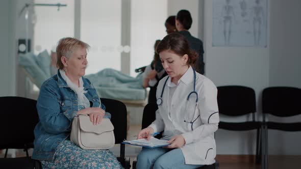 Close Up of Doctor Giving Medical Advice to Senior Woman