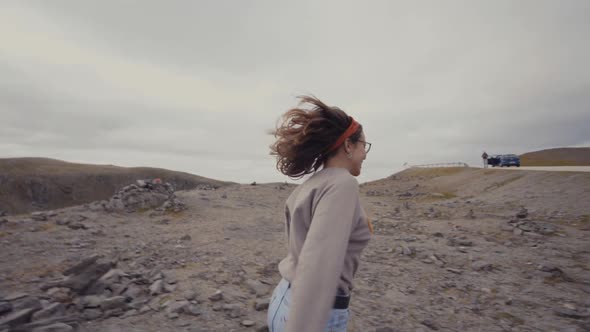 Woman running towards van on roadside