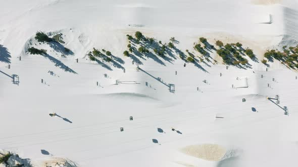 Aerial Drone Footage of Skiers and Snowboarders on Mammoth Lake Ski Mountain