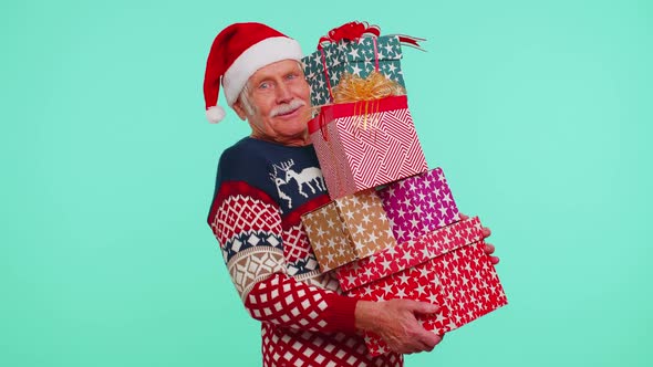Mature Grandfather Man in Christmas Sweater Holding Many Gift Boxes New Year Presents Shopping Sale