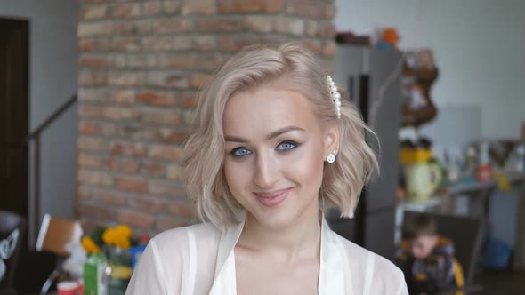 Portrait of a Beautiful Young Woman Looking Into the Camera