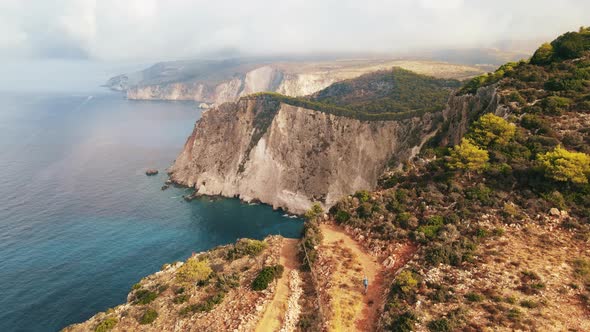 Aerial drone view of the Ionian Sea coast of Zakynthos, Greece. Tourist walking