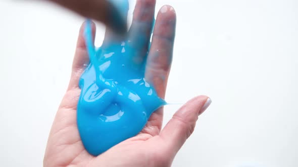 Girl Stretching Blue Slime to the Sides