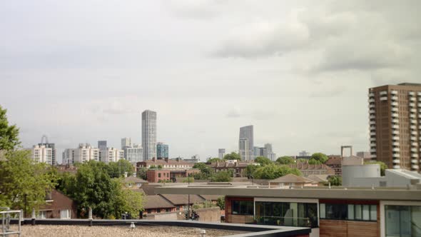 East London skyline with modern skyscrapers. Panorama panning left