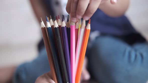 Child Girl Holding Many Color Pencils