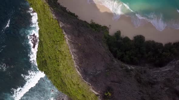 Amazing aerial view flight slowly circle camera pointing down drone shot peaceKelingking Beach at N