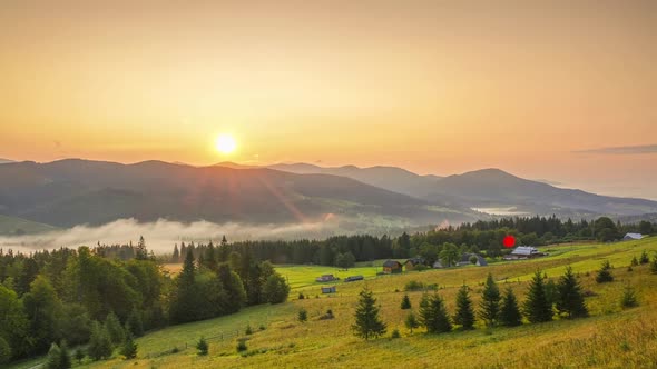 Sunrise Over the Mountains and Fog in the Valley