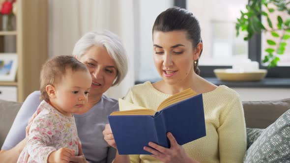 Mother, Daughter and Grandmother on Sofa at Home