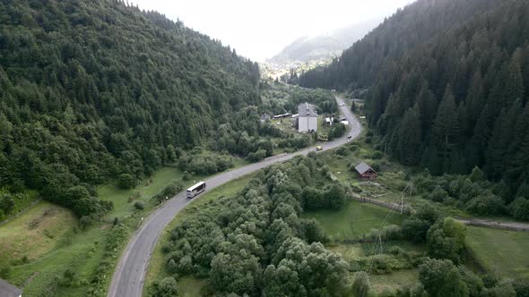 Bus Moving By Mountain Road in Carpathian Mountains