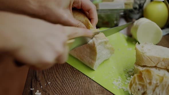 Woman Trying to Cut Bread with a Dull Knife Blunt Blade