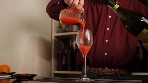 Barman prepares an Italian cocktail called Fragolino