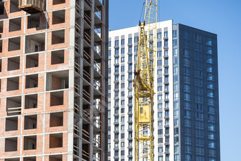 Construction of apartment buildings, dense urban development. The process of construction of