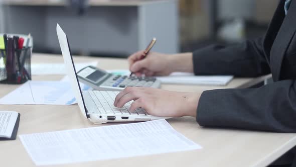 Man Working On Laptop In Modern Office