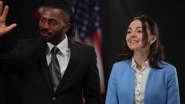 Elegant African American Man and Caucasian Woman Greeting Public in Camera Flashes Smiling and