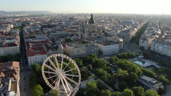 Flying over Erzsebet square and Budapest Eye in Hungary