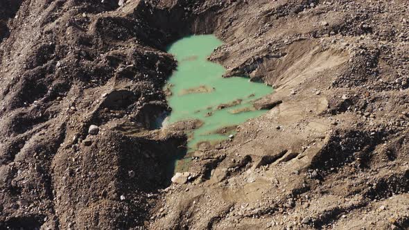 Aerial View of Little Lakes Glacier Melt Creating Bluegreen Lakes Rounded By Rock Mountains