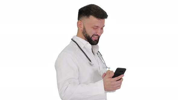 Arab Doctor Walking Using Smartphone and Laughing on White Background.