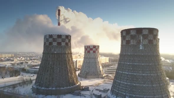 Upper View High Pipe Produces Smoke Clouds Among Steam