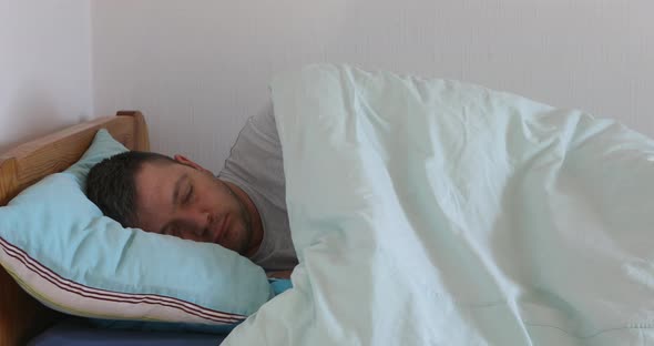 Sick man showing thermometer with high temperature result