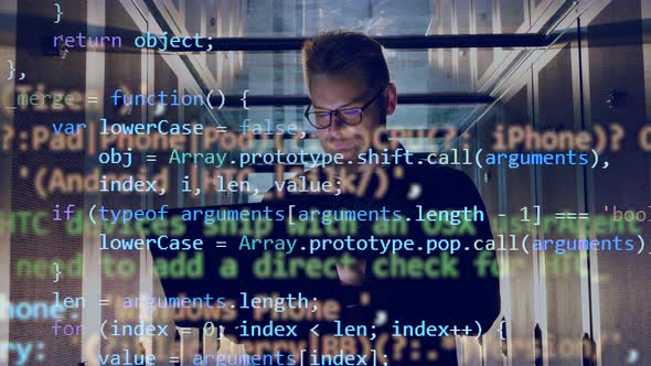IT Engineer Is Operating a Laptop with Encrypted Code Going Above Him