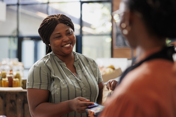 African american woman using mobile payment