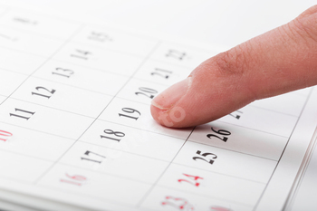 Check out the dates in a business calendar concept