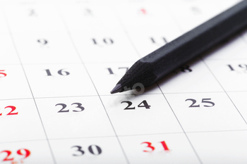 Check out the dates in a business calendar concept