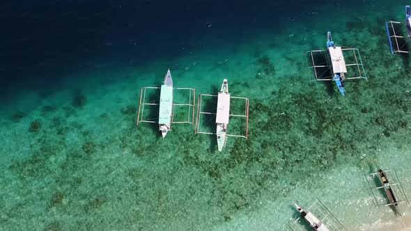 Aerial fly-over view of boats at Entalula Island, Bacuit Bay, El-Nido. Palawan Island, Philippines